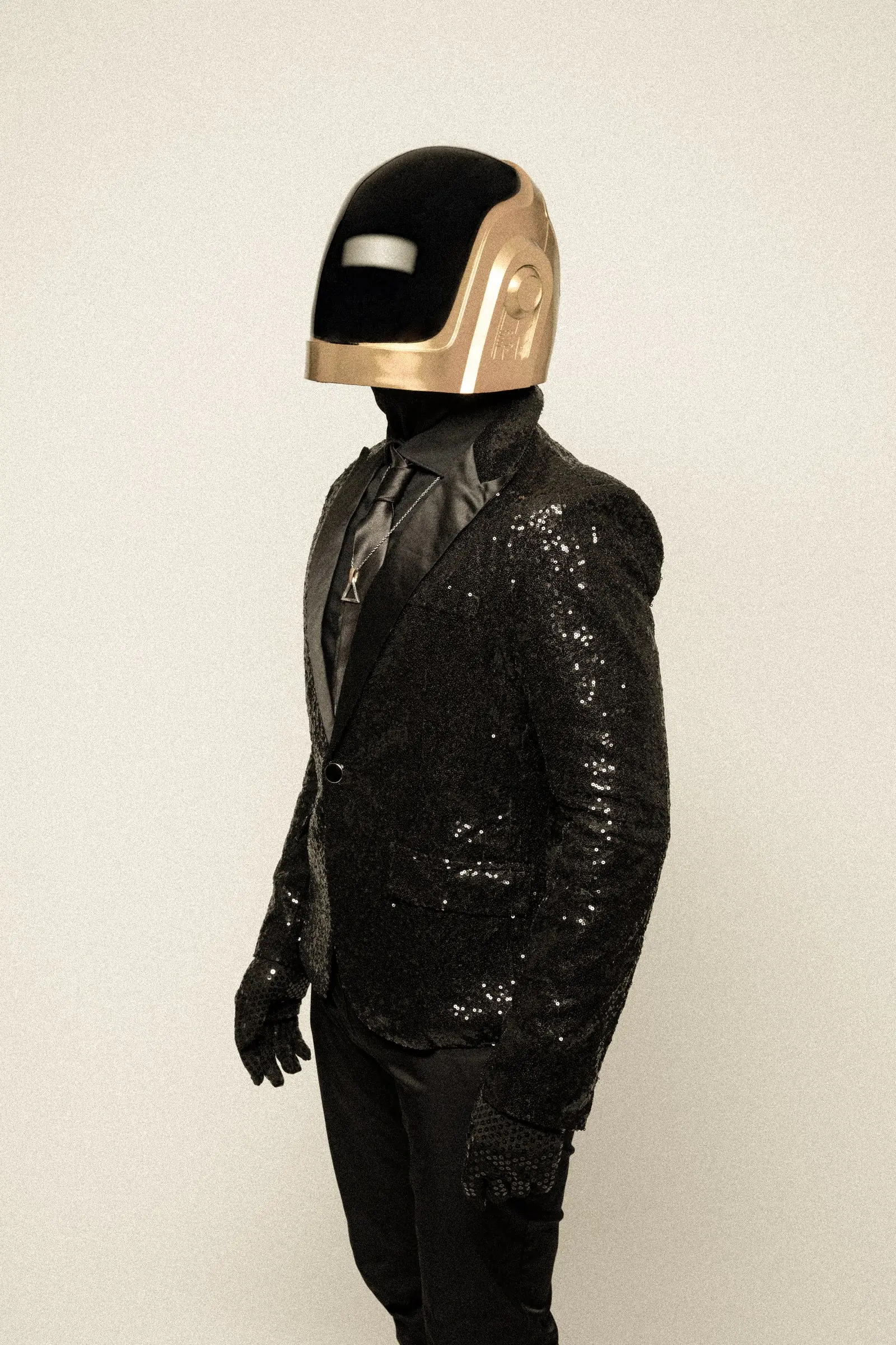 The gold-helmet performer in profile